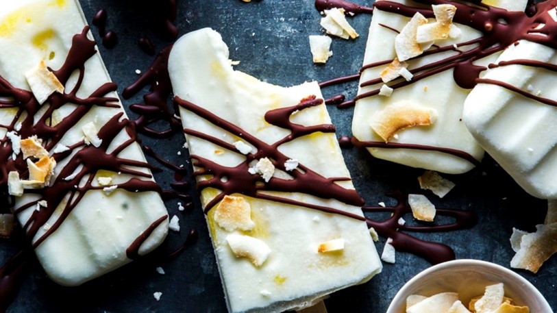 An assortment of frozen desserts with chocolate on top