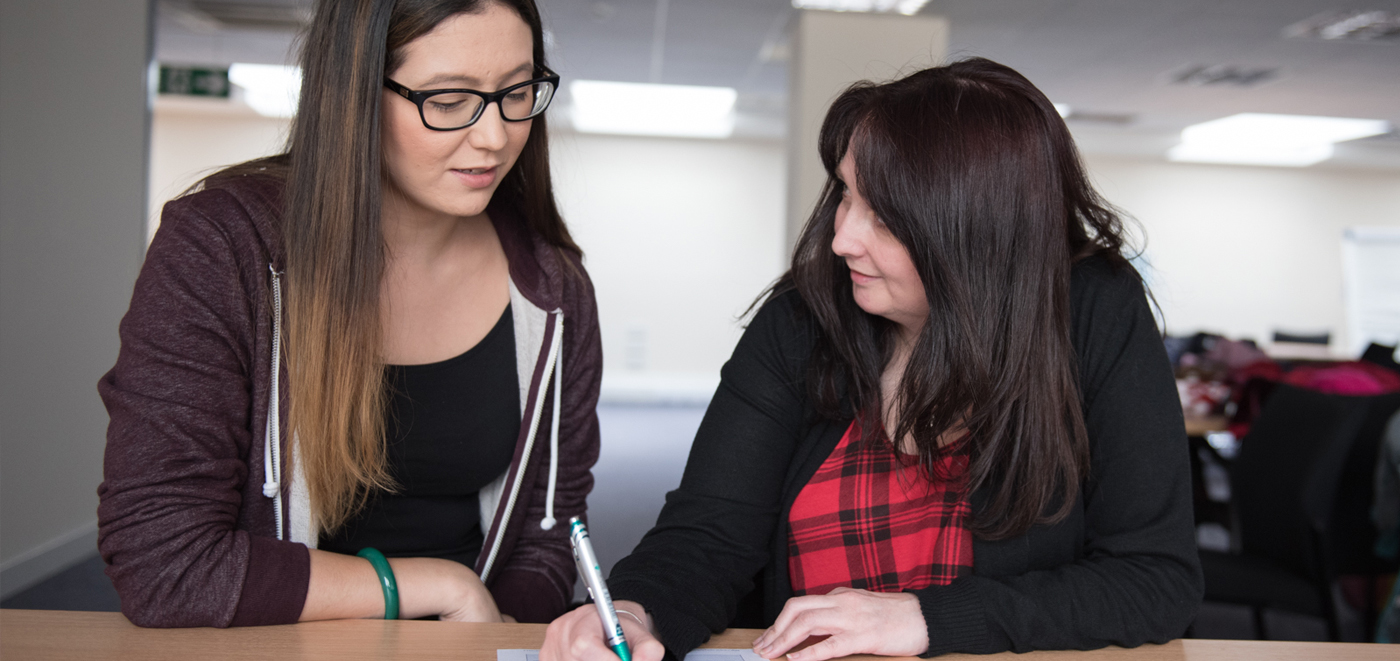 2 girls are disusing on Crime Impact Assessment